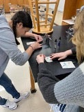 Two students doing experiment